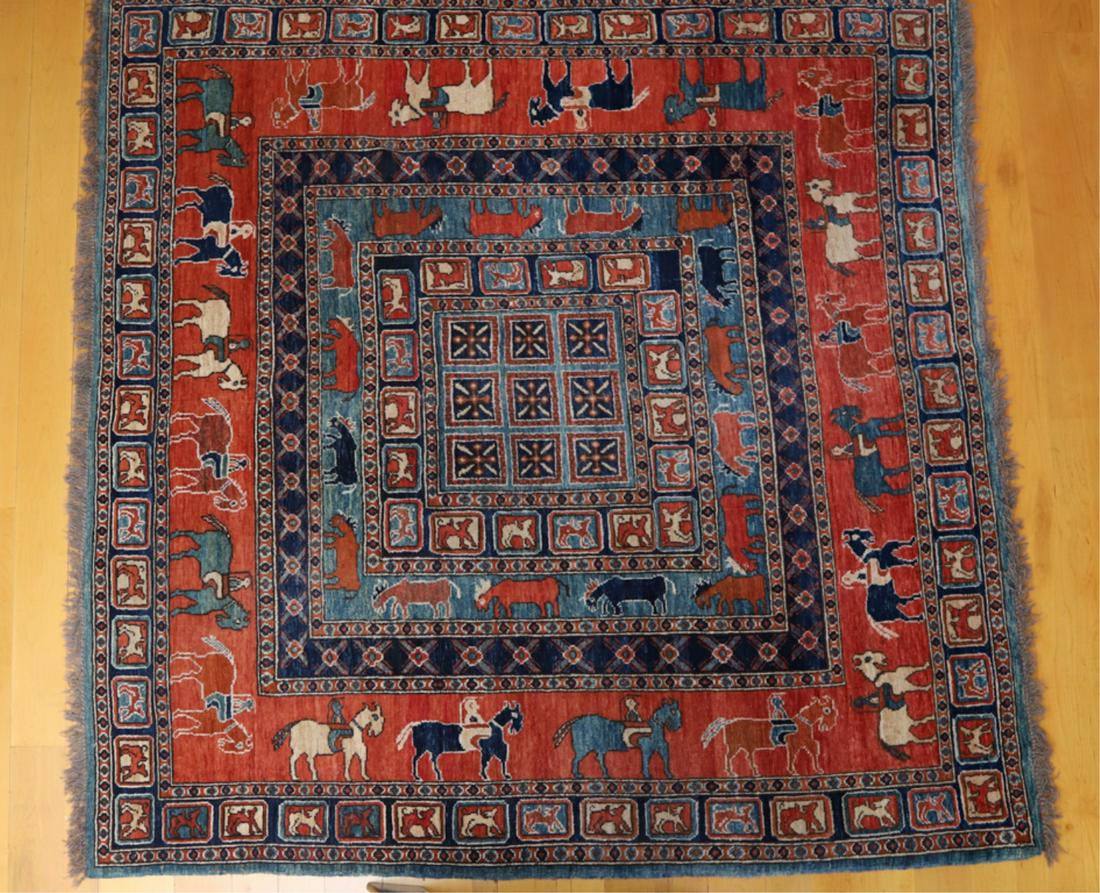 MODERN TRIBAL PAKISTANI AREA CARPET: Center with geometric designs and multiple borders of animals and figures on horseback. 7 feet 6 inches x 6 feet 11 inches