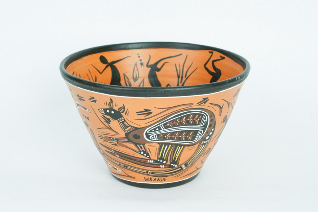 ABORIGINAL POT: Tapered in form, polychrome decorated with mythical animals and birds, the interior with a bird and figures, indistinctly signed near base, 6 x 9 inches