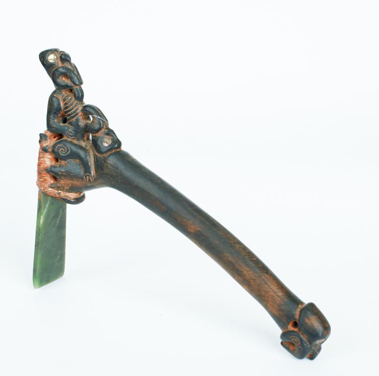 CARVED AFRICAN RITUAL AXE: Inlaid with abalone and inset jade cutting blade. 17 x 10.5 inches