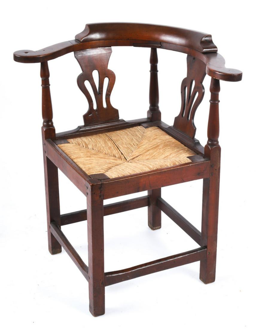 (18th c) CHIPPENDALE WALNUT CORNER CHAIR: Scrolled arms, pierced splats and drop rush seat raised on straight legs supported by (4) stretchers. 31 1/2 x 30 x 24 inches. Attributed to Maine. Condition: Age crack to top of rear leg, surface ble