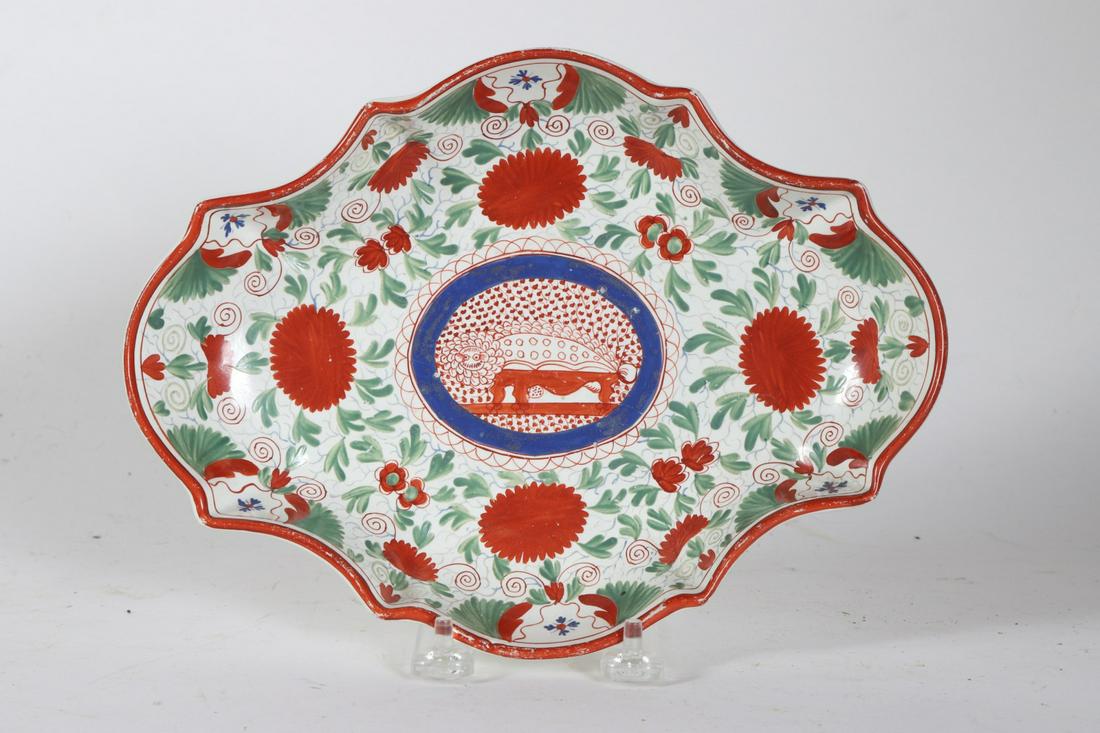EARLY STAFFORDSHIRE SERVING DISH: Pearlware hand painted in (3) colors over-glaze with lion or porcupine and floral motifs. 520 annotated under base. 7 x 9 3/4 inches Condition: (2) hairlines Temp No 6115