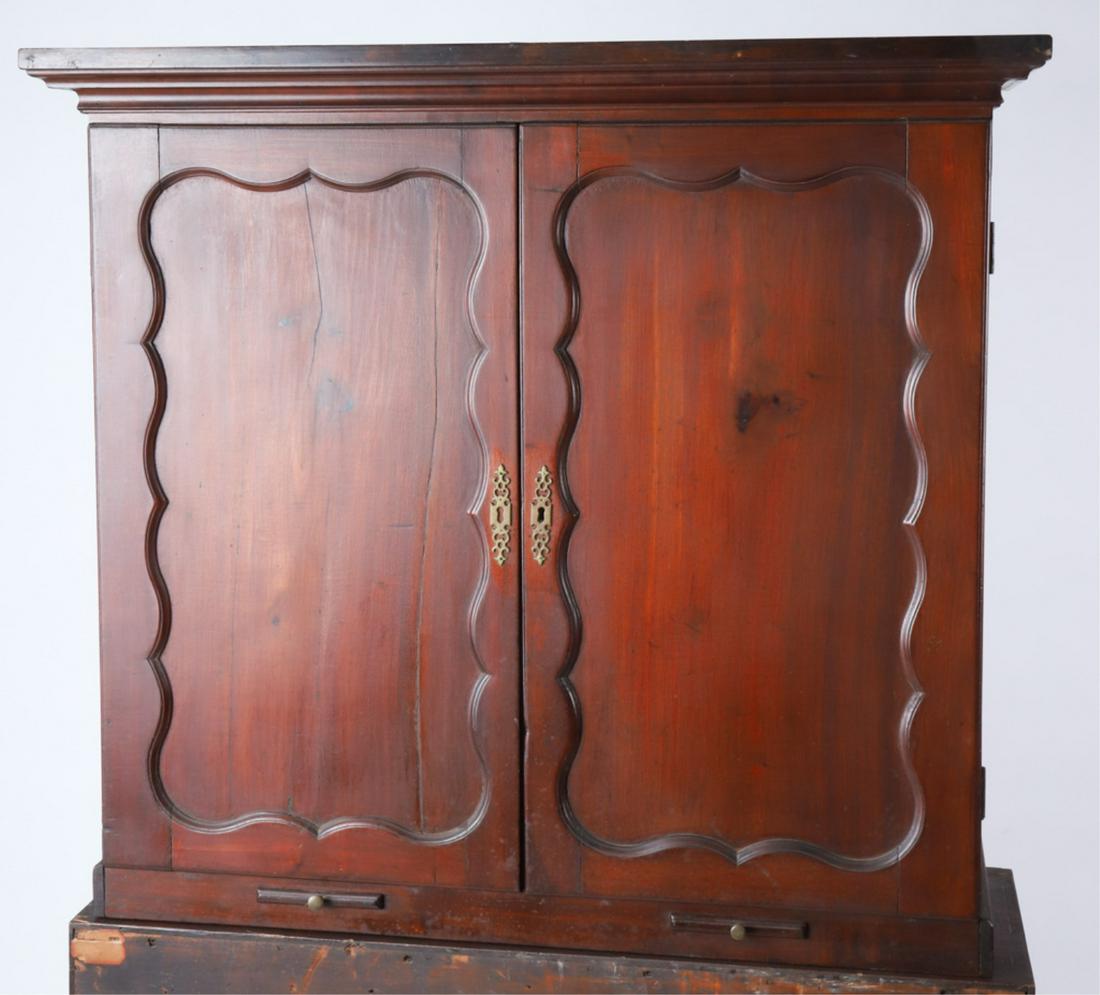 CHIPPENDALE MAHOGANY SECRETARY TOP: Molded top surmounts cabinet with shaped paneled doors opening to an interior fitted with molded shelves and (3) drawers. Below cabinet are (2) slide out shelves for candles. 38 1/2 x 42 2/3 x 13 1/2 
