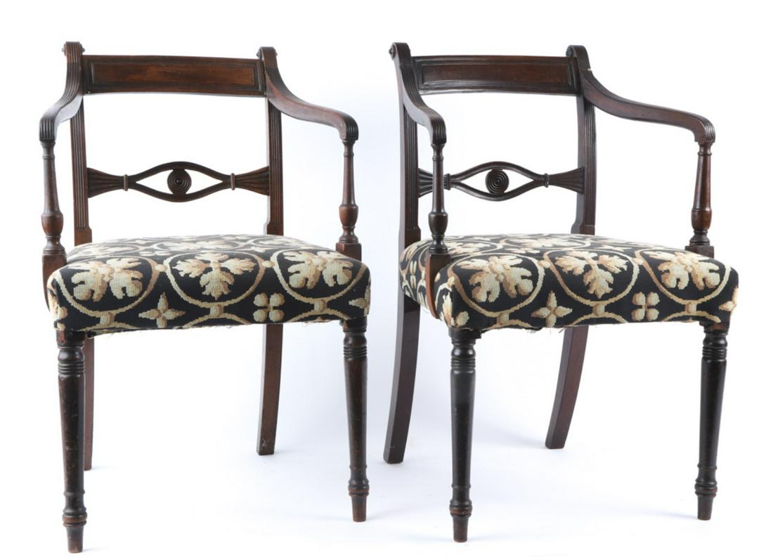 PAIR OF (19th c) UPHOLSTERED MAHOGANY ARMCHAIRS: Paneled top rail, carved and pierced cross rail, molded arms with vasiform supports and turned legs. 32 1/2 x 20 x 17 inches. Condition: Finish inconsistencies, repair / damage to ear and arm support 