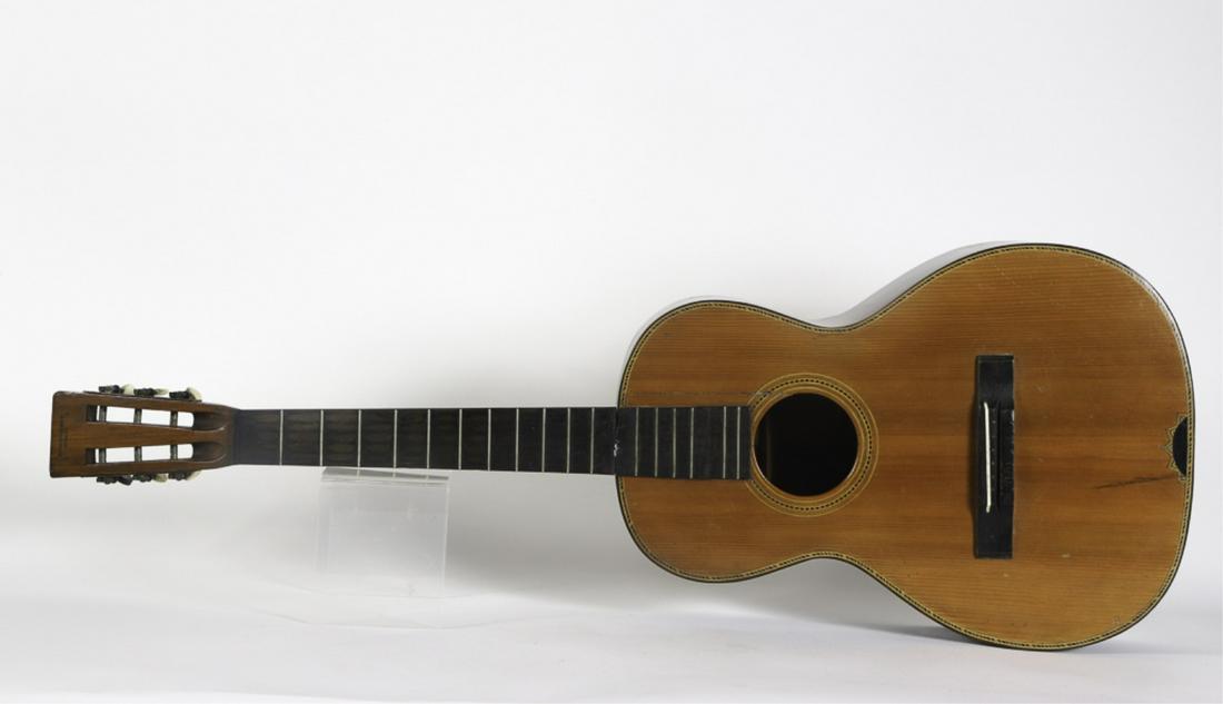 GUITAR EMBOSSED "ROOT & SONS MUSIC CO CHICAGO": Acoustic guitar finely inlayed. 38 inches. Condition: Neck repairs at body, strings absent, crack to front and back of body Temp No 6029