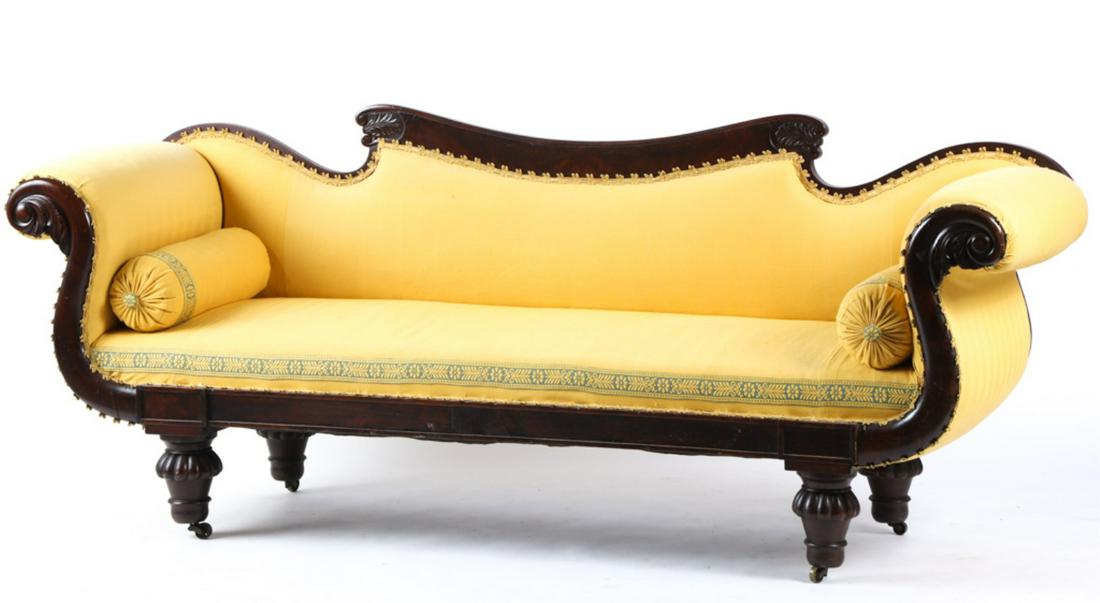 CLASSICAL MAHOGANY AMERICAN SOFA: Scrolled back and arms carved with volutes and acanthus leaves. Raised on petal-carved and turned legs, most likely by Vose or another of the period. 33 x 82 x 23 inches Condition: Good, fabric pulls 