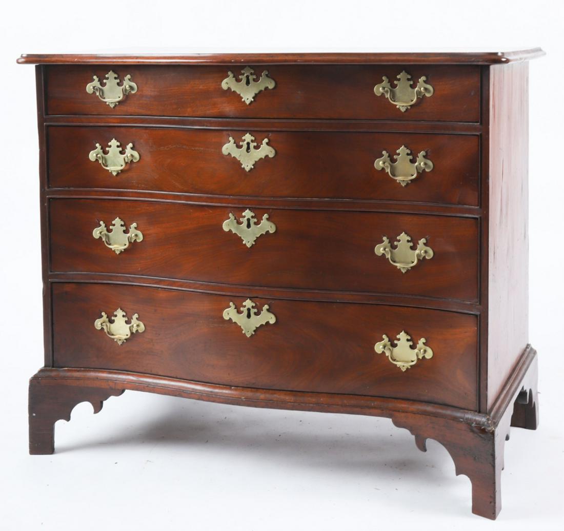 CHIPPENDALE MAHOGANY SEPENTINE CHEST OF DRAWERS: Molded serpentine top and conforming cock beaded case with (4) graduating drawers raised on a molded base with bracket feet and shaped returns. 32 1/4 x 39 1/4 x 20 inches. Condition: Restored feet, b