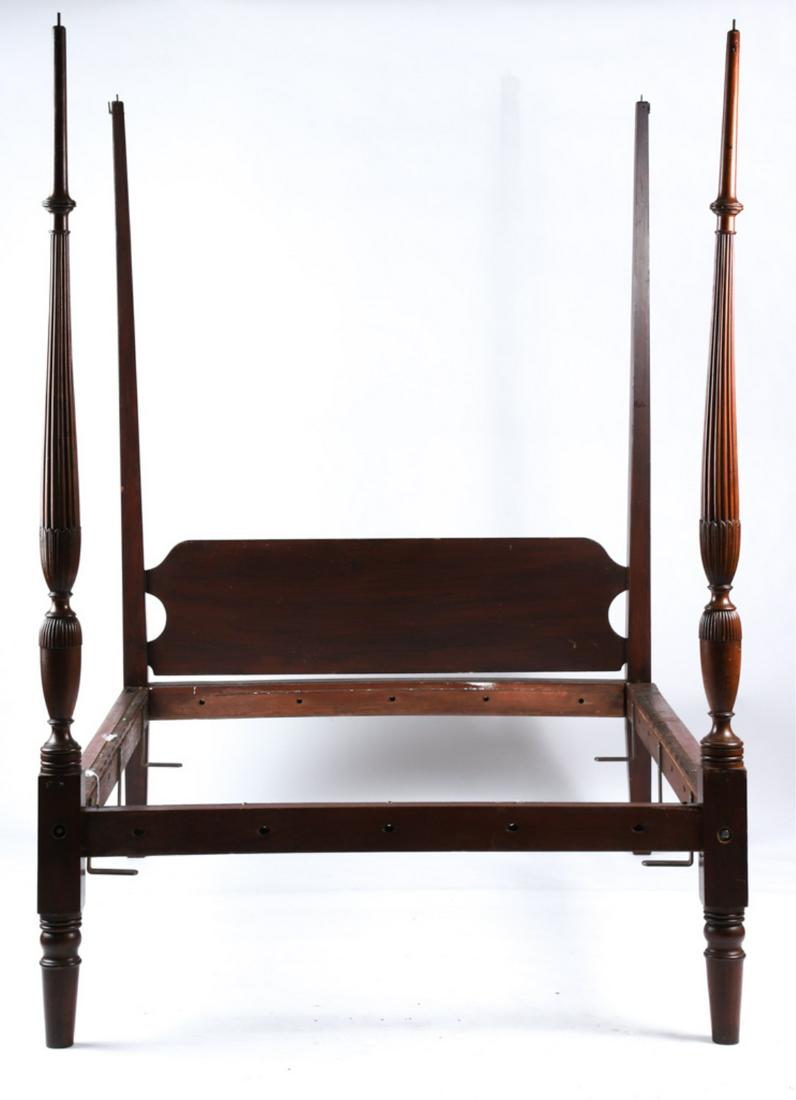 (Early 19thc) BOSTON MAHOGANY (4) POSTER FIELD BED: Late Federal period with shaped head board, pencil posts and foot with carved and vase-turned examples at the foot. 82 x 72 x 57 inches. Condition: Canopy absent, scattered unobtrusive finish wear, fi