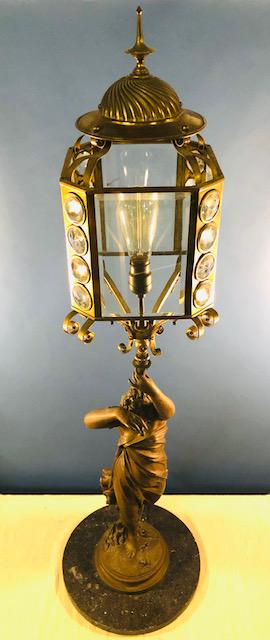 OLIN LEIR WARNER (1844-1896): Banquet lamp "Leaving a Path of Roses" bronzed zinc allow 54 inches (to top of final). signed and dated Paris 1872. Provenance: Eagle Mountain House, Jackson, NH. Condition: Good, mounted to a newer m