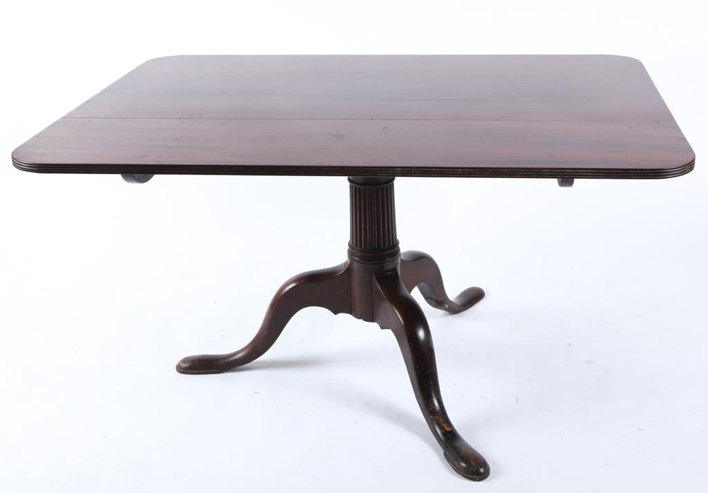 (18th / 19th c) MAHOGANY TILT TOP BREAKFAST TABLE: Rectangular molded top with rounded corners supported by a classical fluted column post, cabriole legs and slipper feet. 28 x 37 3/4 x 52 inches. Provenance: "Stony Acres" Kenneth Roberts estate in Ke