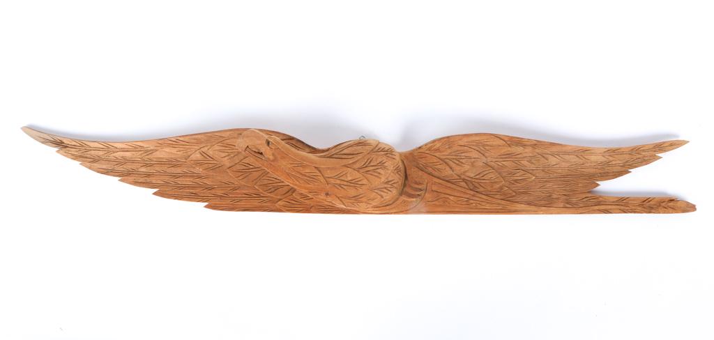 (Mid 20th c) CARVED PINE AMERICAN EAGLE PLAQUE: 51 x 5 1/2 x 5 inches. Condition: Good, tip of lower left wing is a little rough Temp No 6318