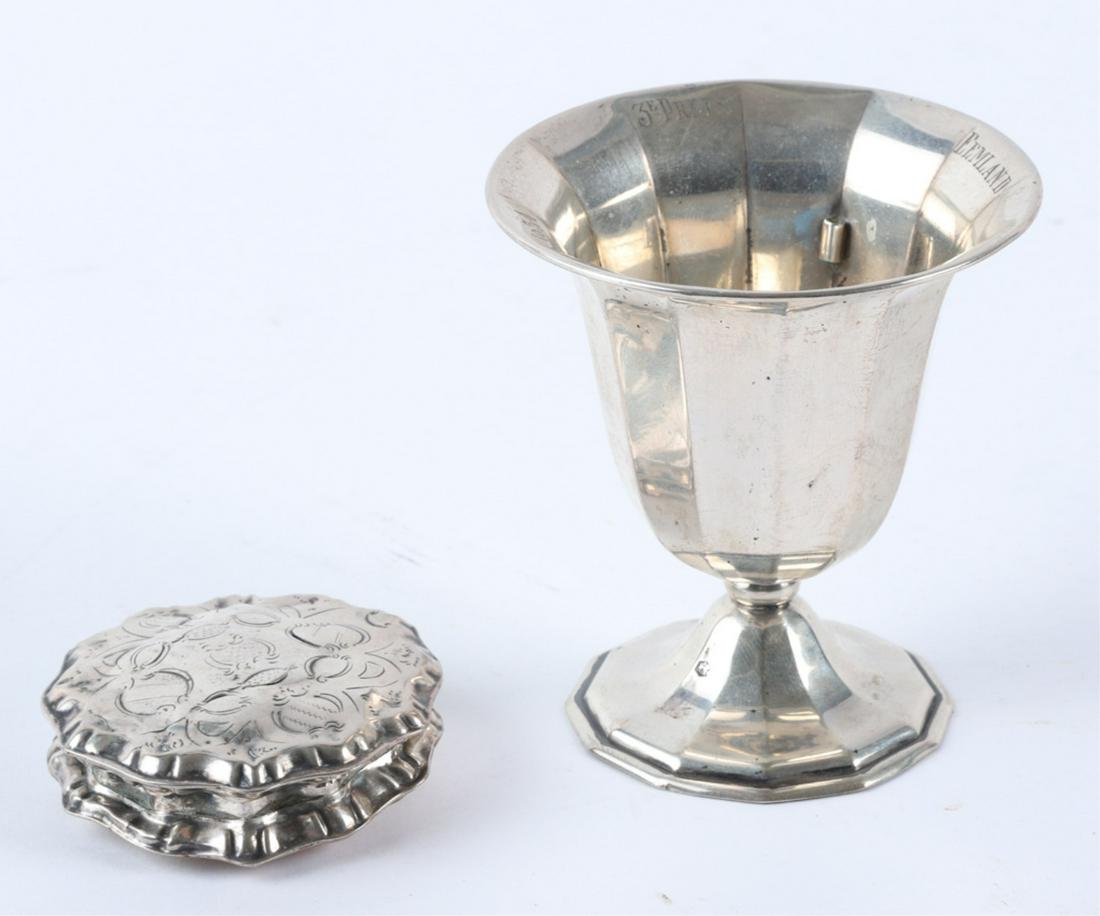 STERLING SILVER TROPHY & CLAMSHELL CASE: Eemland, Netherlands 3rd place trophy dated 1934. 3 1/2 inches (weighted). Together with a hinged piecrust-form case with engraved cover. 2 1/4 inches Condition: Trophy appears to have a missing eleme