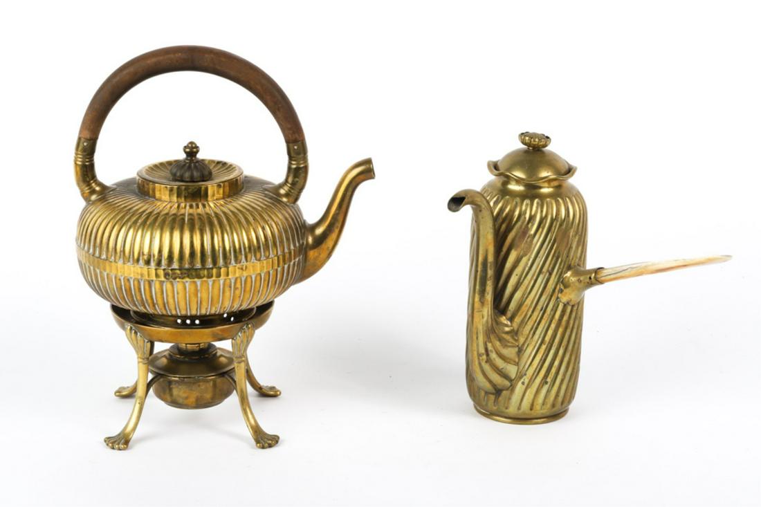 GORHAM & CO BRASS TEAPOT on STAND & COFFEE POT: Ribbed teapot with fixed wooden handle and finial rests on stand with burner. Together with a twist rib coffee pot with offset bone handle and floral finial. 11 1/2 and 8 1/2 inches Condition: Good, c
