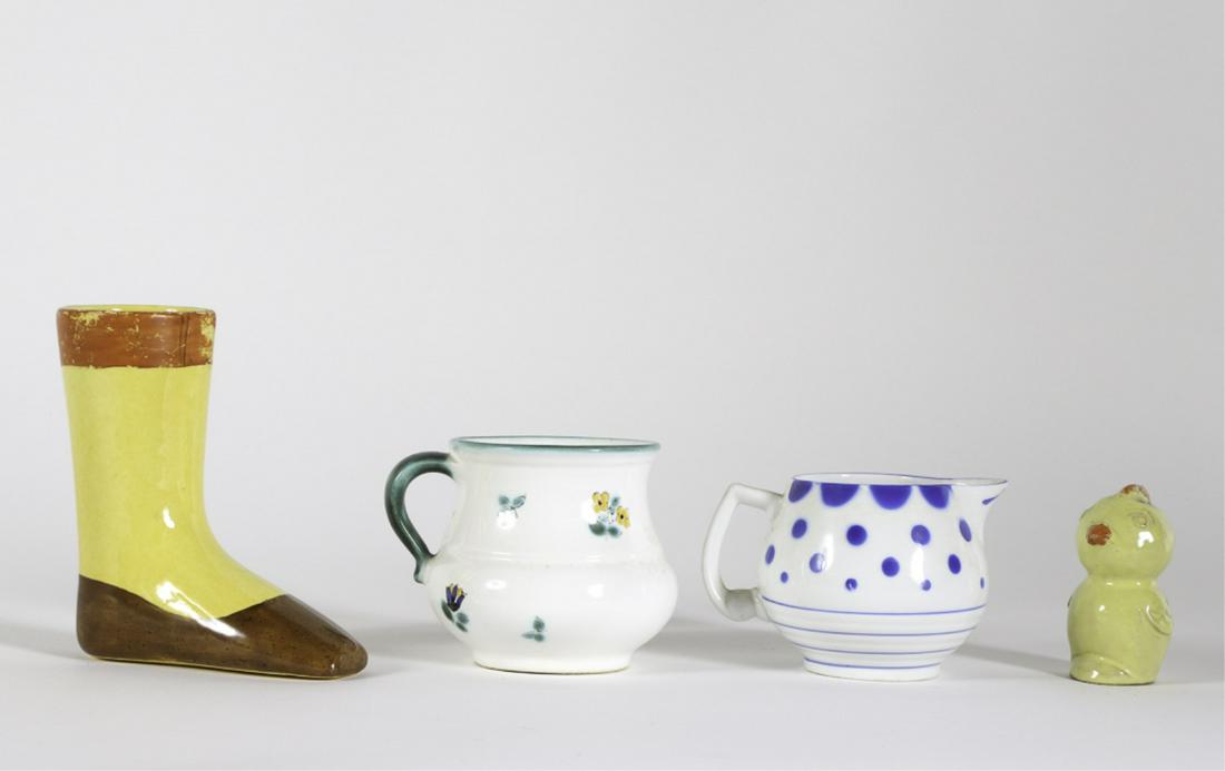 EARLY CANARY GLAZED SHOE/BOOT CUP: With later creamer, mug and chick shaker. Creamer marked Erphila, mug marked Gmunden. Chick redware shaker and shoe cup are unmarked. 5 inches (and under) Condition: Wear and marginalia to finish of s
