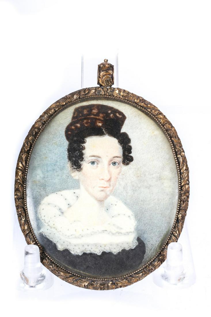 FEDERAL PERIOD PORTRAIT OF A WOMAN: Wearing a tortoise shell back comb. Presented in a period frame with milgrain bezel