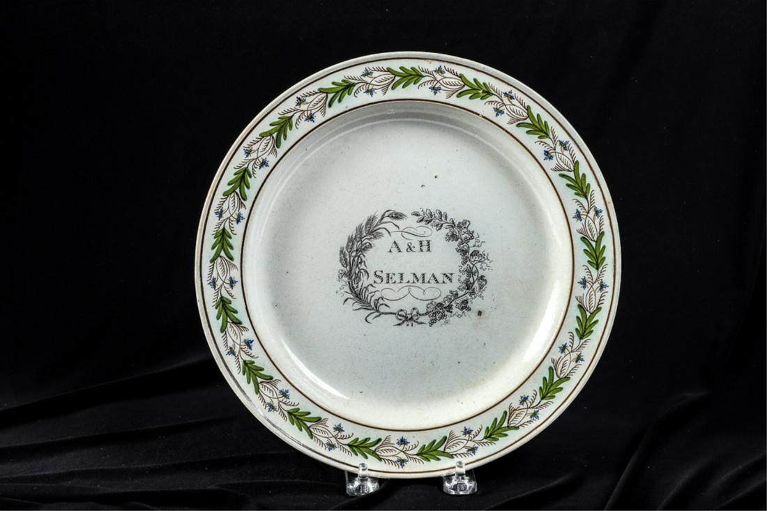 1792 A & H SELMAN OF MARBLEHEAD PEARLWARE PLATE: Transferware cartouche with wheat and grapevine frames the name A & H Selman. Rim hand painted with trig and floral band. 9 3/4 inches. Note: Archibald and Hannah Griffin married on 6/21/1792.