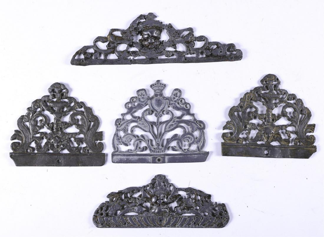 (5) BAROQUE CAST METAL ESCUTCHEONS: Cast in a variety of similar forms. 4 1/2 x 5 inches and 2 1/2 x 9 1/2 inches (and smaller)