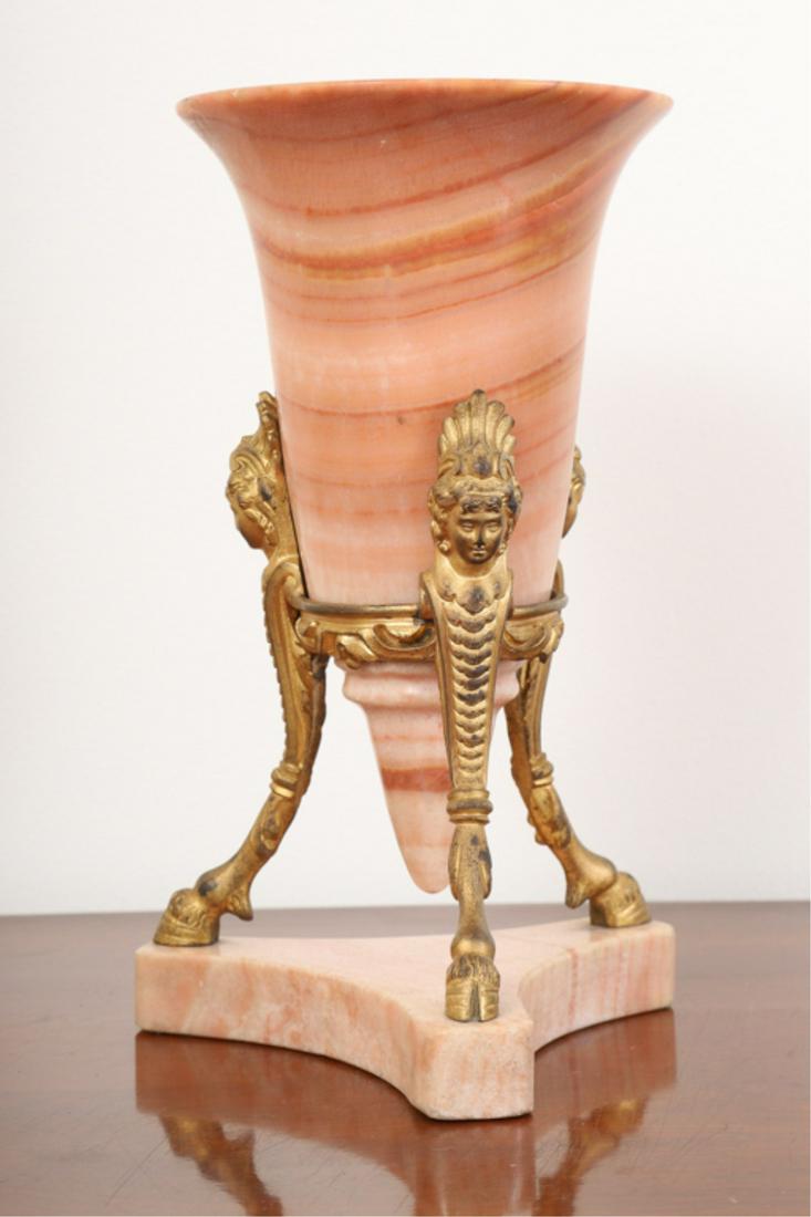 FRENCH ONYX VASE with ORMOLU MOUNTED BASE: Turned conical font nests in figural tripod stand raised on onyx base. 8 3/4 inches.