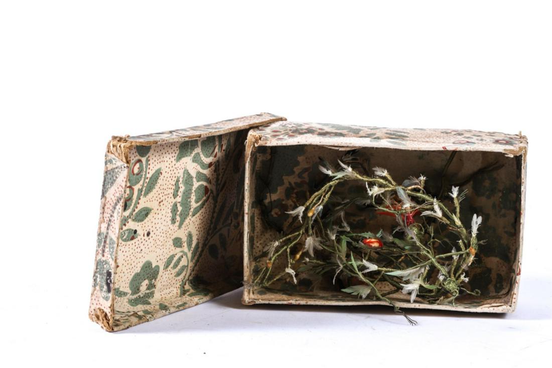 1827 BOX made by ELIZA WOODBURY with SILK TIARAS: Hand-sewn wallpaper covered paperboard box contains a variety of silk wrapped wire boughs with natural feather flowers. (possibly to be worn in the hair) Box measures 2 1/2 x 6 x 3 3/4 inches