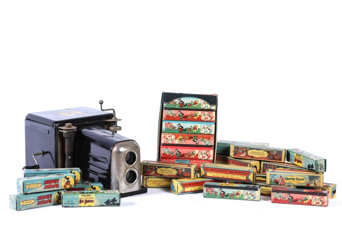 MICKEY MOUSE MOVIE-JECTOR: Together with approx. (25) Movie-Jecktor Films. 10 1/2 x 9 x 5 inches.