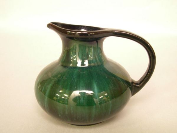 Canadian blue mountain pottery in green glaze. R: Canadian blue mountain pottery in green glaze. Raised tree mark within triangle. Height: 4".