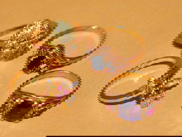 Four gold rings, 10k black hills gold, 10k blue sa: Four gold rings, 10k black hills gold, 10k blue sapphires and four diamonds, 10k square purple stone with two red side stones, 14k three ruby and six small diamonds