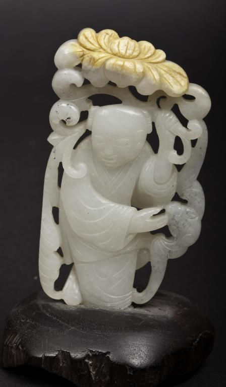 Carved jade figure in a garden. Early to mid 20th: Carved jade figure in a garden. Early to mid 20th century. Height: 3 1/4 in.
