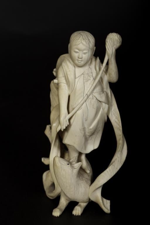 19th/20th Century Japanese ivory carving of boy st: 19th/20th Century Japanese ivory carving of boy standing on animal signed. Height: 4 3/4"