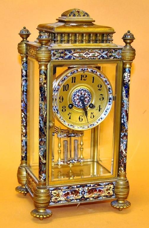 French crystal regulator clock with champleve enam: French crystal regulator clock with champleve enameling and original gilt surface and pendulum. Height: 14 1/2"