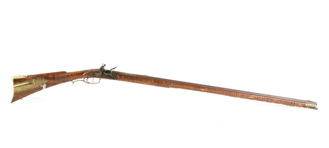 KEITH CASTEEL KENTUCKY STYLE FLINTLOCK MUSKET: Finely carved tiger maple stock inlaid with scrolled wirework, engraved silver American eagle and engraved brass patch box "Who is There Left to Mourn for Logan, Not One" and hardware. Octagonal barre