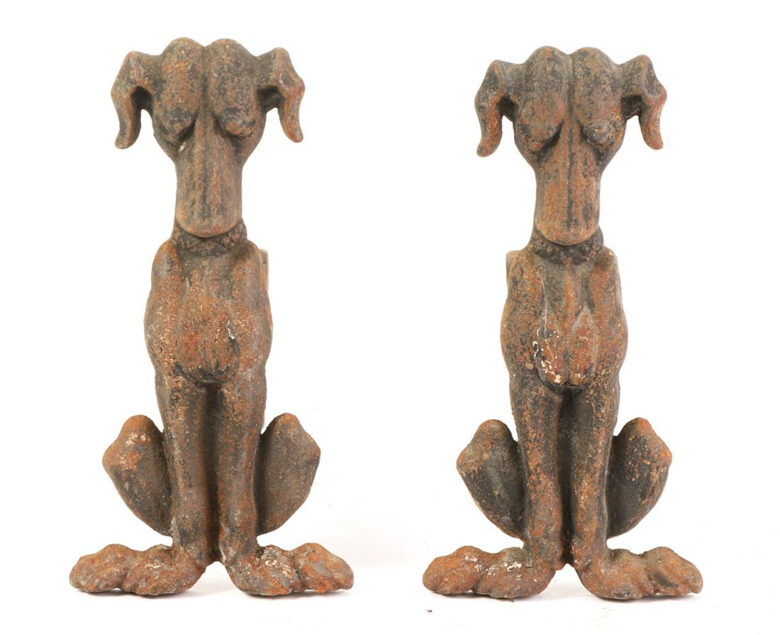 PAIR OF CAST IRON HOUND-FORM ANDIRONS: Puddle cast. 14 x 7 x 17 inches