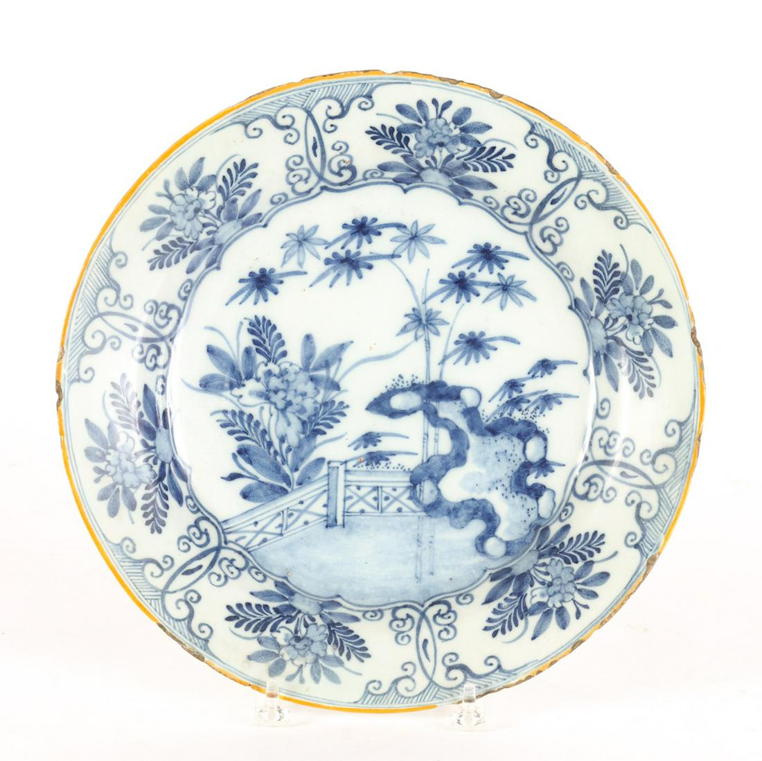 (18th / 19th c) CHINOSERIE DELFT CHARGER: Asian inspired garden, floral and bamboo motif. 13 3/4 inches