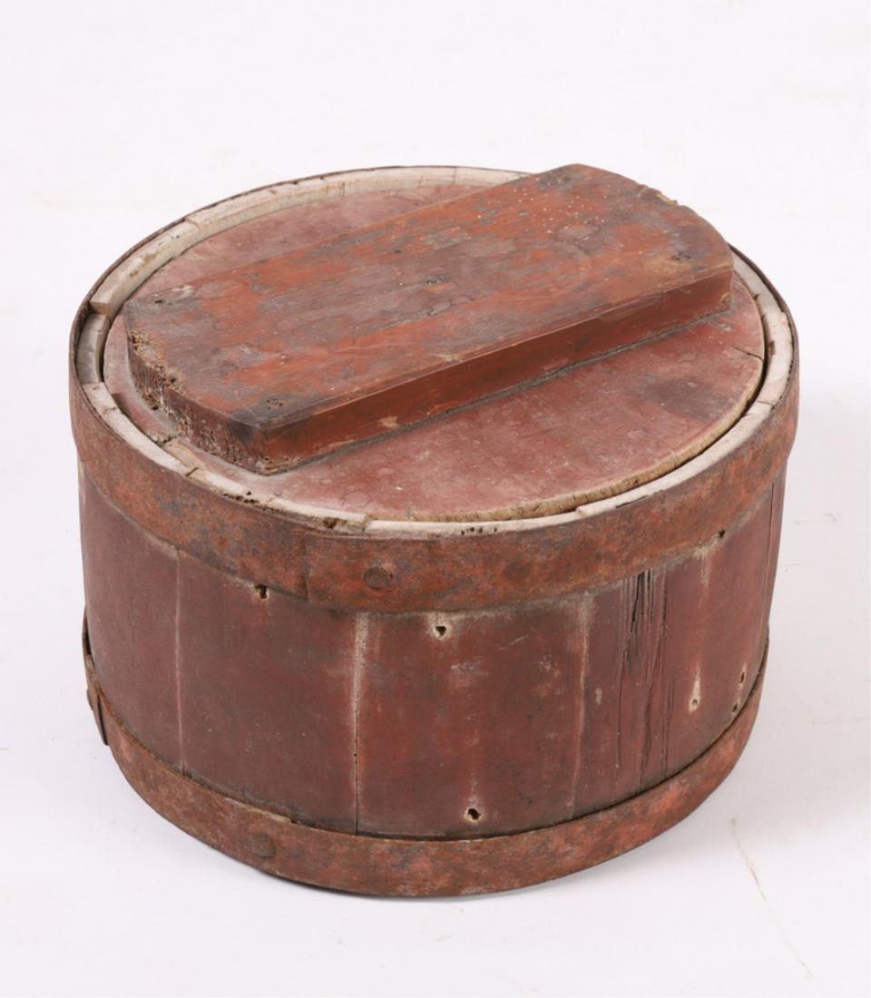 WOODEN CHEESE BOX in RED PAINT: Barrel stave construction with iron hoops, block handle and wooden ring insert. 8 1/2 x 12 inches
