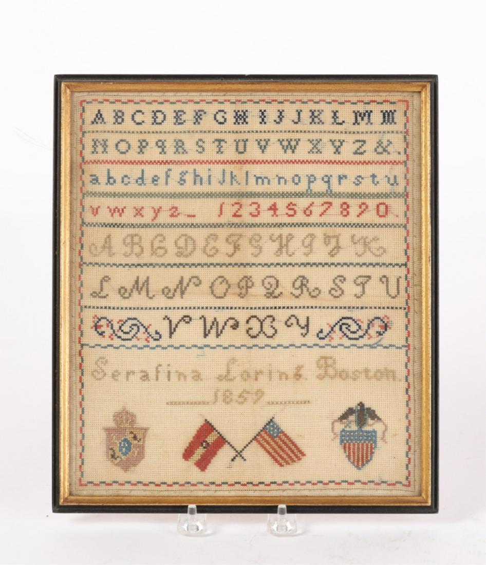 ALPHA NUMERIC SAMPLER by SERAFINA LORING BOSTON: Dated 1859. Blue and red border with the flag and shield of the United States. 11 x 9 3/4 inches (overall including Foster Brothers frame)