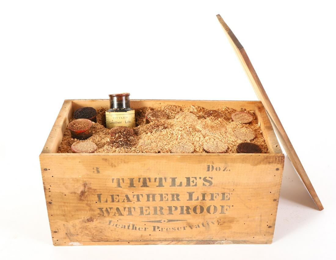 ORIGINAL BOX OF TITTLE'S LEATHER LIFE BOTTLES: Stenciled wooden crate filled with (18) unopened bottles of waterproofing. Together with a number of handbills and signs advertising the product. 7 1/2 x 16 x 8 1/2 inches