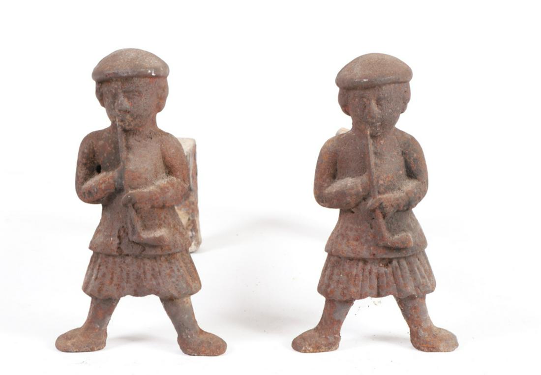 PAIR OF CAST IRON SMOKING FIGURAL ANDIRONS: Puddle cast. 11 x 7 x 15 inches.
