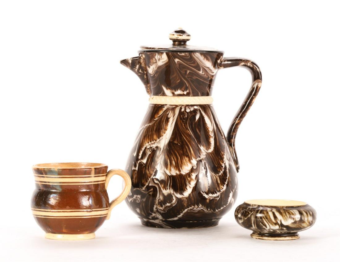 MOCHA WARE AGATE DIPPED PITCHER, SALT and CUP: Cream ware pitcher 8 inches, Banded handled cup 2 3/4 inches and a salt dated 1879.