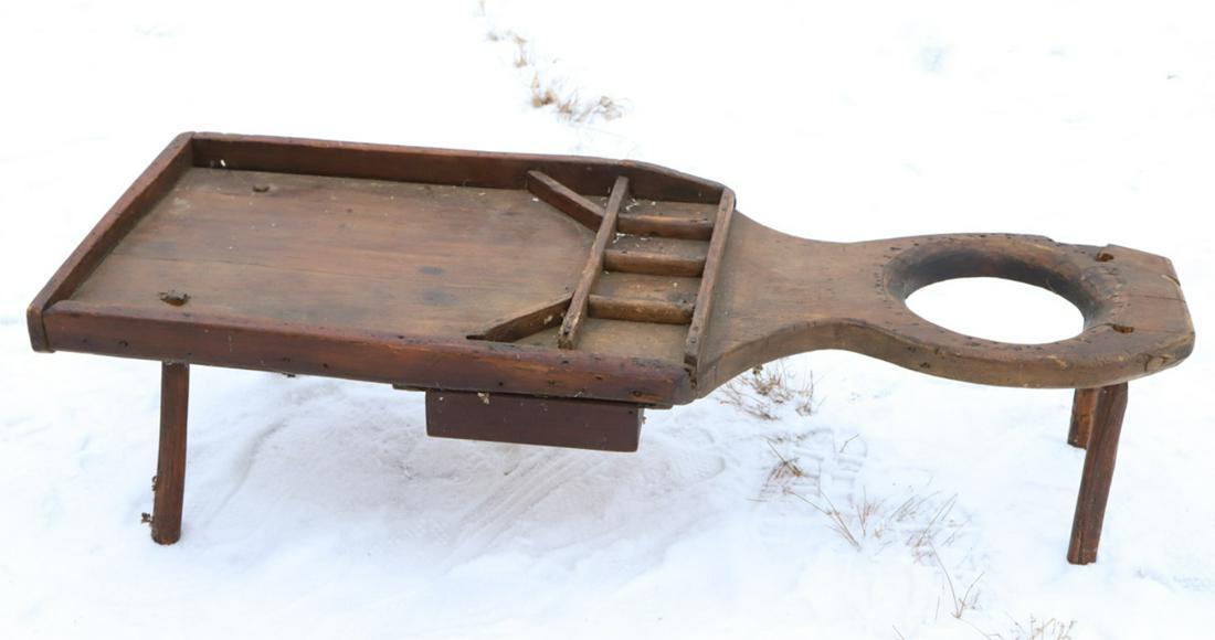 PRIMITIVE COBBLER'S BENCH: Single plank construction with applied divided sections, under drawer and hand-hewn splayed legs. 14 x 53 x 20 inches.