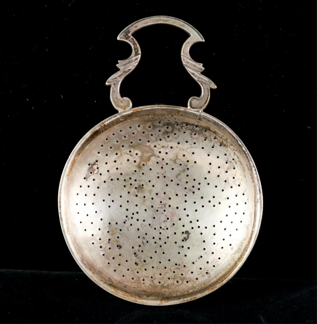 18c CHARLES HALL OF LANCASTER PA SILVER PUNCH STRAINER: Marked C-Hall in bowl. This is a rare mark, pieces are usually mark CH. This is a Single shaped handle and rim clip. Strainer pierced in a (6) petal floral pattern. 5 5/8 inches. He worked as a silver