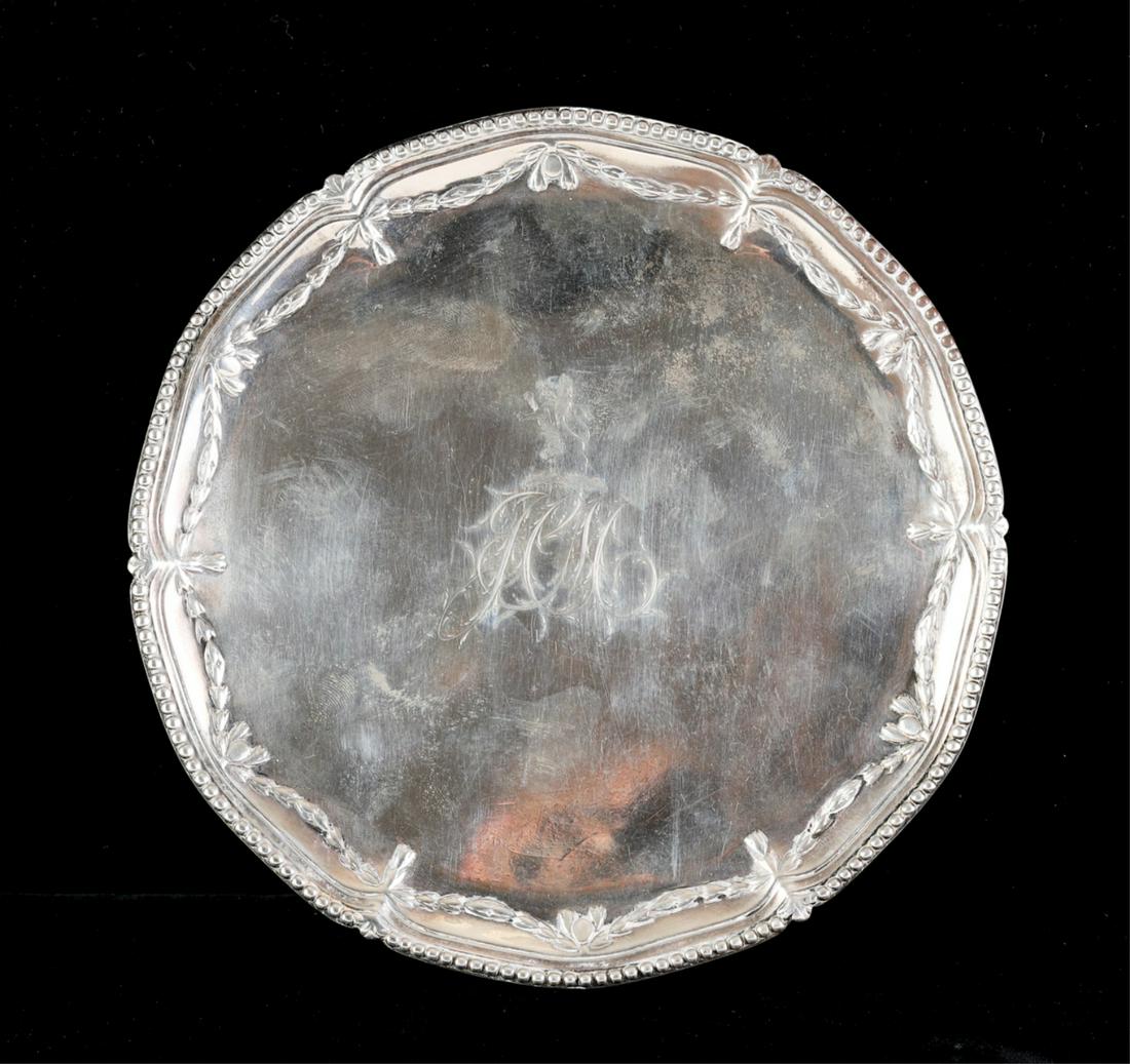 ENGLISH STERLING SILVER SALVER: Rim embossed with beads and bell flower swags and raised on (3) ball and claw feet. Stamped with a makers mark "RM RC". 1 1/8 x 7 1/8 inches. 9.1 troy ounces