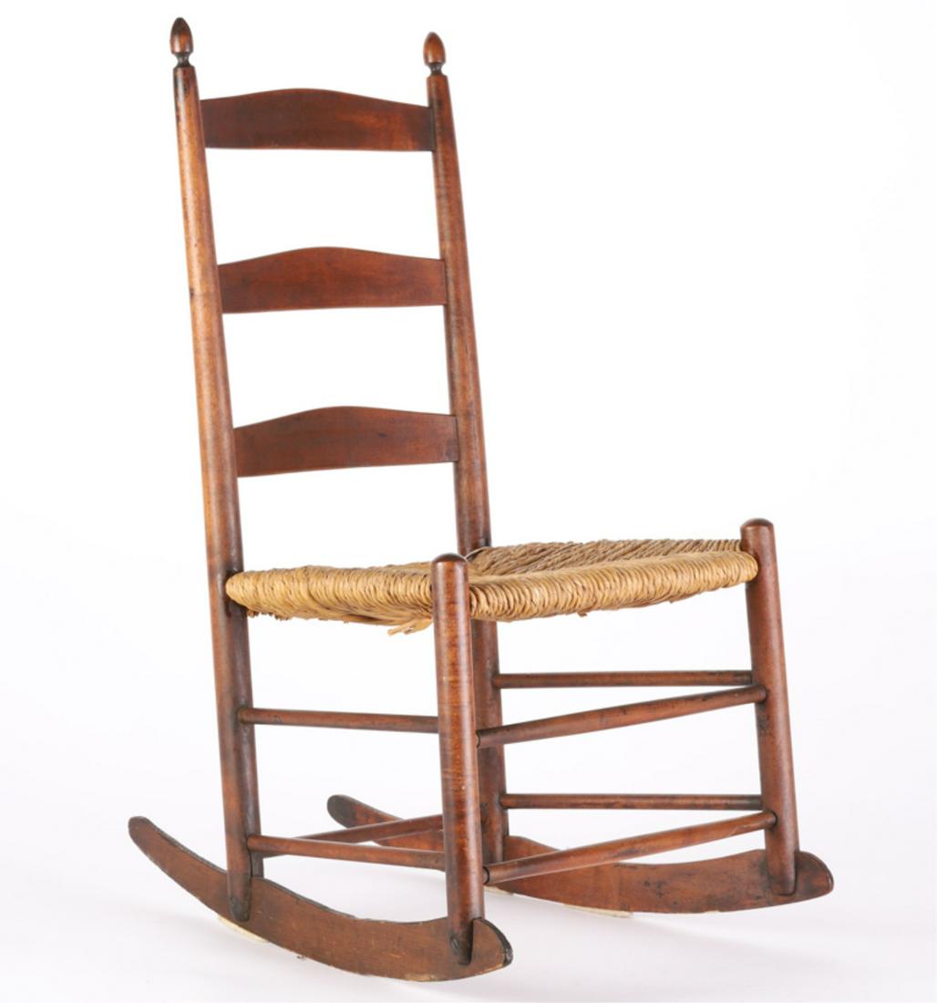 JUVENILE'S SHAKER ROCKING CHAIR: Turned acorn finials and rush seat. 29 x 16 x 20 inches