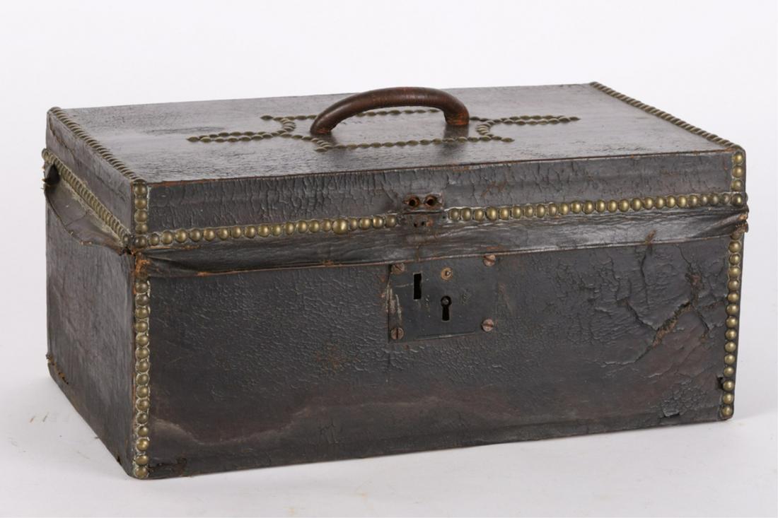 (19th c) LEATHER TRUNK by NATHAN NEAT with LABEL: (Early 20th c) Boston. Wooden document box covered in leather and decorated with brass tacks. 7 1/2 x 16 1/2 x 10 inches. N.B. Lid embossed J.H. Snow.