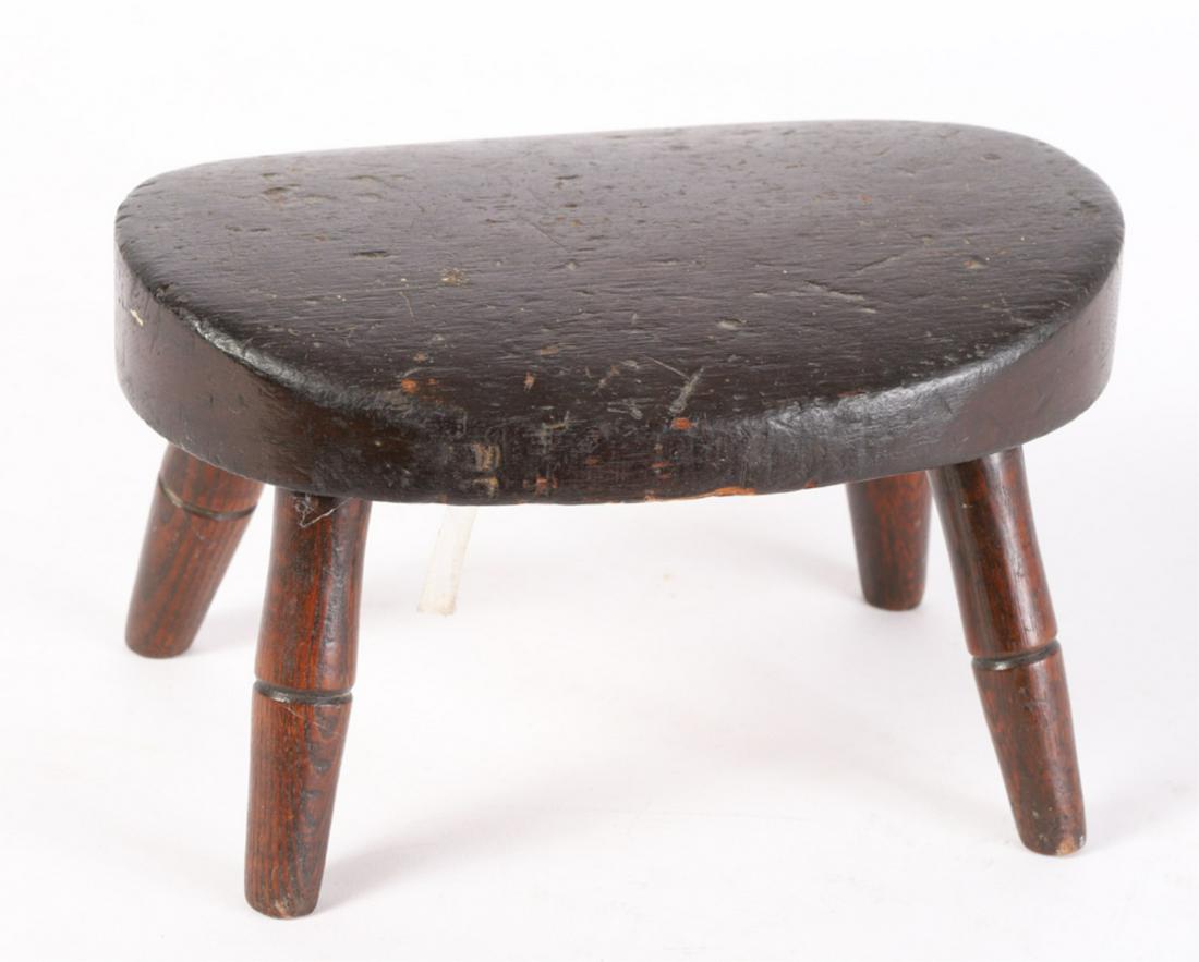 WELL WORN FOOTSTOOL USED IN DEACON ROBERTS CHURCH: Shaped oval top raised on (4) turned legs. 6 x 7 x 10 inches.
