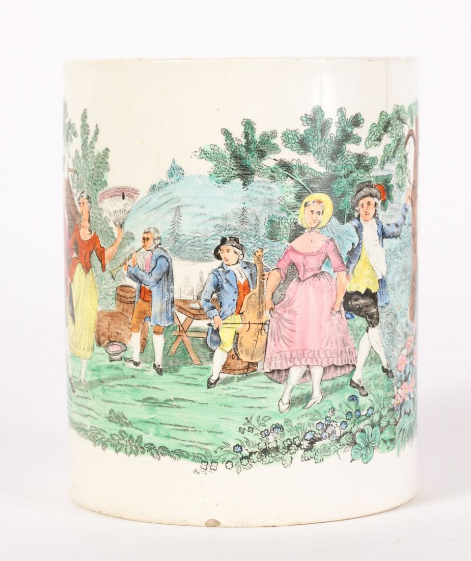 TRANSFER DECORATED CREAMWARE MUG: Depicting a courting scene in the country with couples dancing to music. 6 x 4 3/4 inches (not including applied handle)