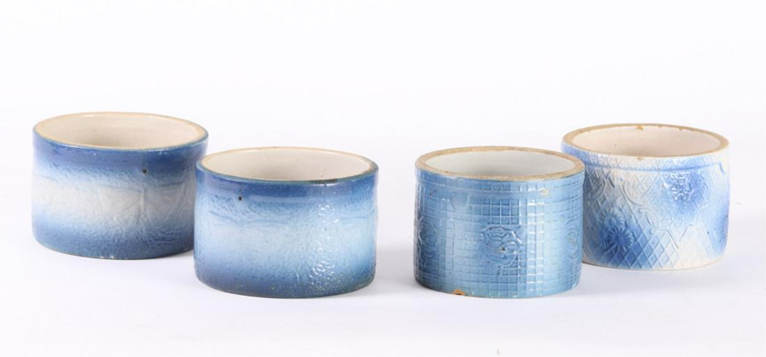 (4) BLUE & WHITE STONEWARE CROCKS / BUTTER TUBS: Including: (2) Moths and (2) basket weaves with flowers. 4 1/4 x 5 3/4 inches