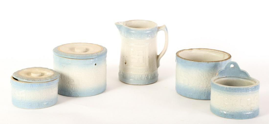 (5) PIECES OF BLUE AND WHITE STONEWARE: Including: Pitcher, (2) covered butter canisters, (1) canister missing lid and handle and a salt cellar missing lid. 9 inches (and under)