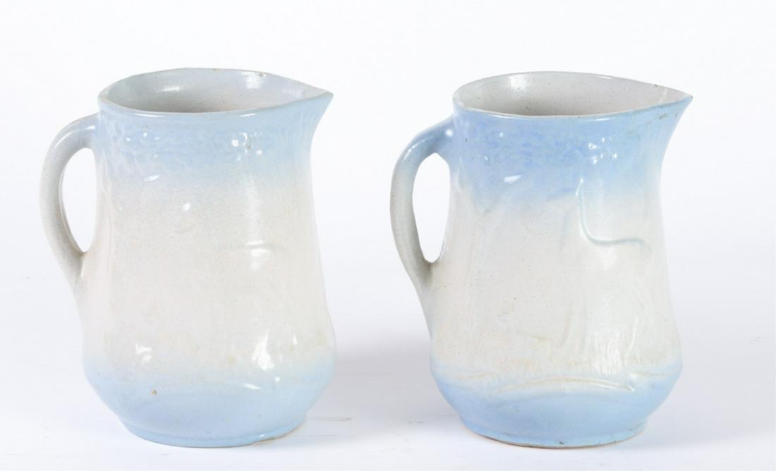 (2) BLUE AND WHITE STONEWARE PITCHERS: "Doe and Fawn Motif" 8 1/2 inches.