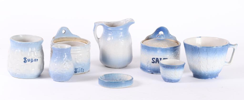 (8) PIECES OF BLUE and WHITE STONEWARE: Including: Pitcher, , (2) salts, sugar bowl, vase, mixing bowl with handle, cup and ashtray. 7 inches (and under)