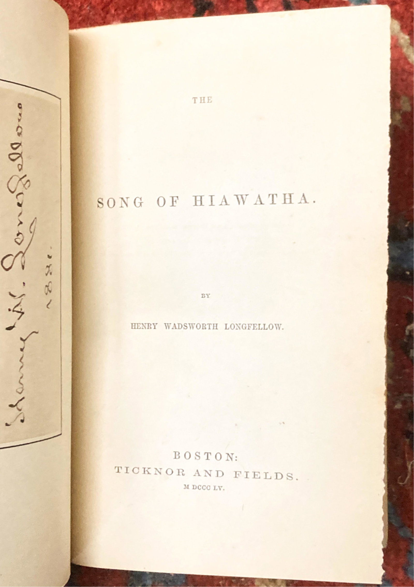 1855 "SONGS OF HIAWATHA" by LONGFELLOW: Boston, Ticknor and Fields, 1855. hardcover 1/2 leather bound. 7 x 4 3/4 inches. Together with a clipped signature of the author