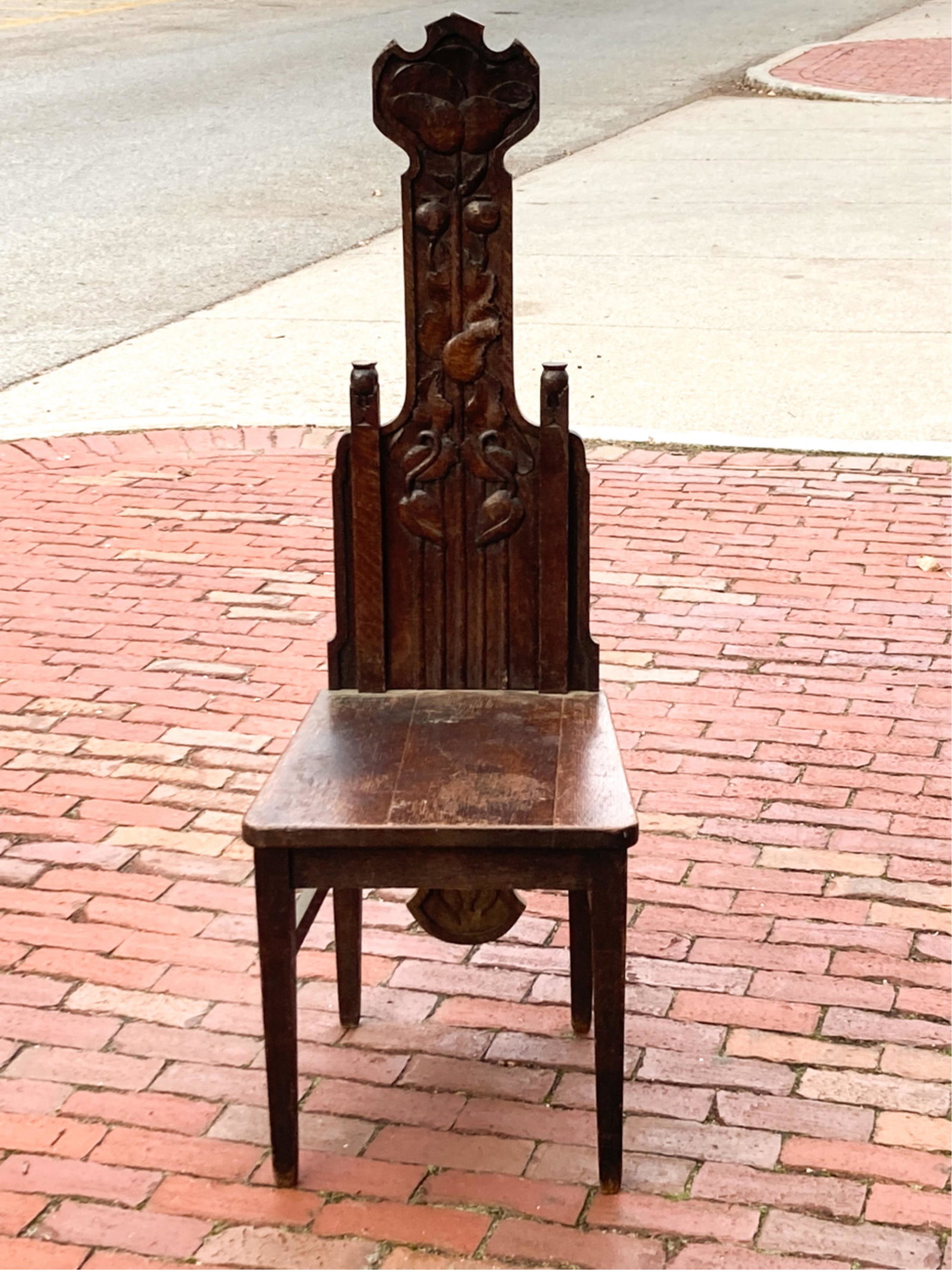 PRAIRIE SCHOOL HALL SEAT with FLORAL CARVED BACK: (Circa 1890-1910) oak. 50 1/2 x 17 x 18 1/2 inches