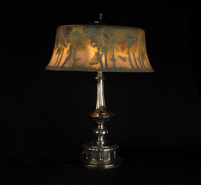 Pairpoint lamp. The shade decorated with trees and : Pairpoint lamp. The shade decorated with trees and butterflies, on a silvered base, signed. Height: 22"" Diameter: 15 3/4""